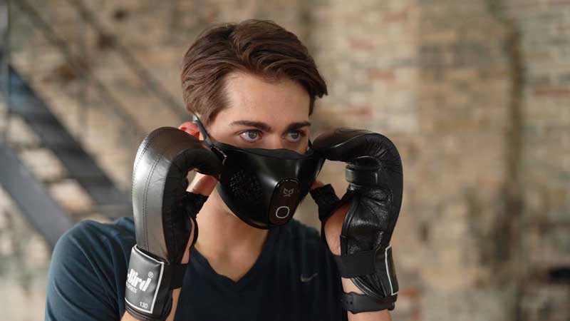 Man wearing the C9 mask exercising